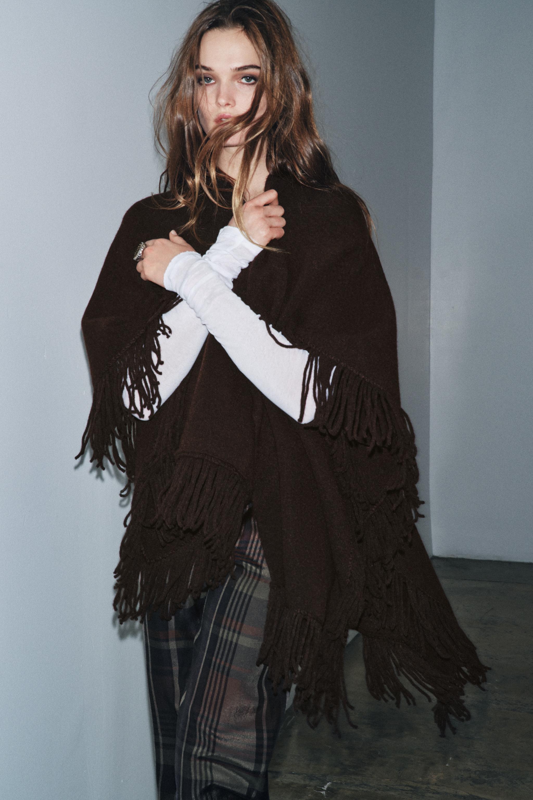 FRINGED KNIT CAPE